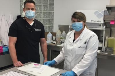 Medical laboratory technologist Alison Jones, with dermatologist and Mohs surgeon, Dr. Michael Stevens in the onsite lab. 