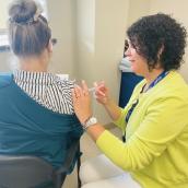 Claudia Aucoin, Health Protection LPN, who works in the immunization program, is shown vaccinating during a drop-in clinic.