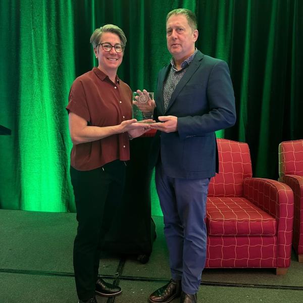 Brigadier General Colleen Forestier presenting the Honour Roll Award to Dr. Todd Howlett.