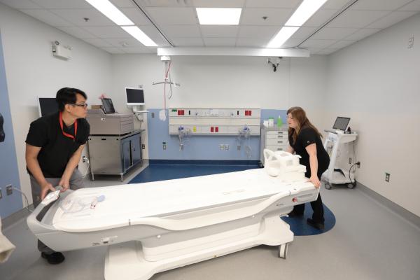 MRI Technologists setting up in-patient transfer room