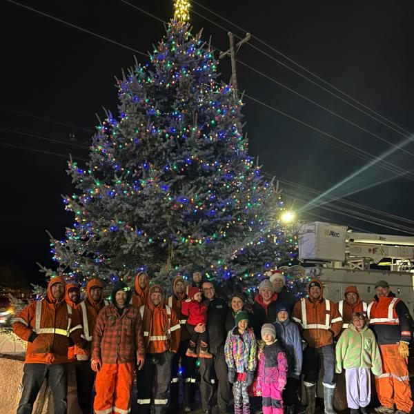 Nova Scotia Power staff in front of the Aberdeen Hospital holiday tree.