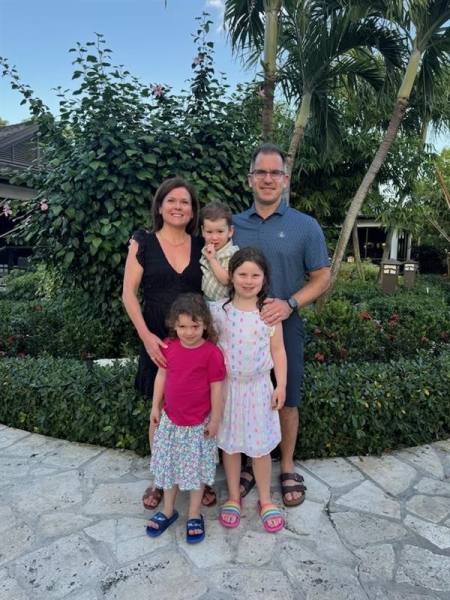 Dr. Stephanie Scott, Gynecology Oncologist in Halifax standing and smiling with her partner and three children